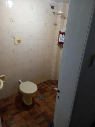a small bathroom with a toilet in a room at Condomínio Verdes Mares in Aracaju