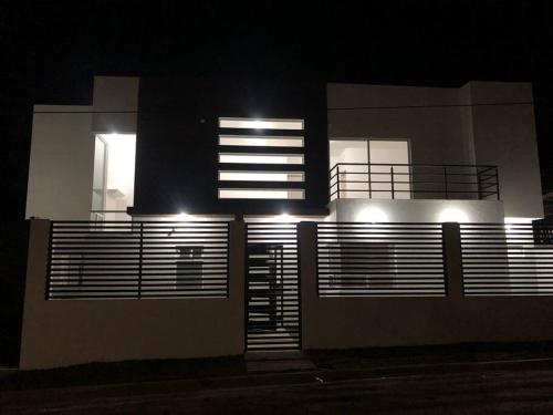 a house with lights on the side of it at night at Residencia en Oaxtepec in Oaxtepec
