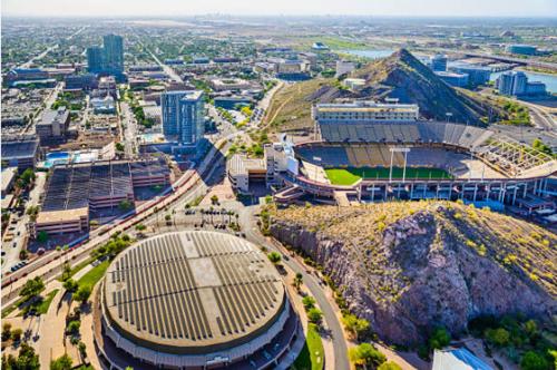 an aerial view of a baseball stadium with a city at LEMONADE SOL in Tempe