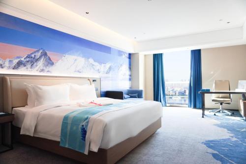 Ένα ή περισσότερα κρεβάτια σε δωμάτιο στο Tianjin Polar Ocean Hotel