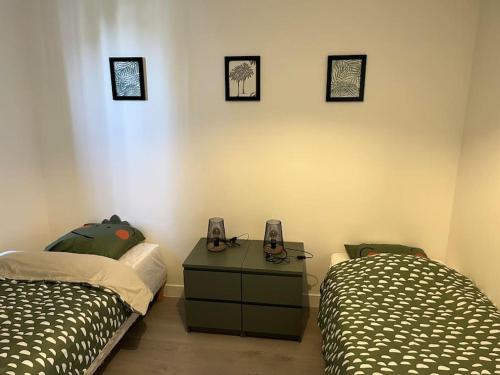 Ein Bett oder Betten in einem Zimmer der Unterkunft Charmant T3. Spacieux et cosy