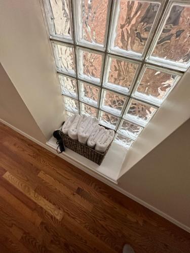 a skylight window in a room with a wooden floor at Harlem House in New York