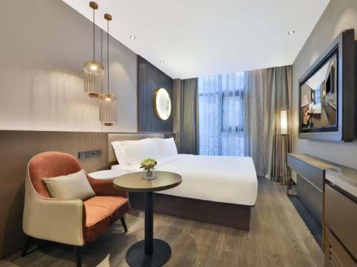 Postel nebo postele na pokoji v ubytování Crystal Orange Hotel - Shanghai The Bund Jinling East Road