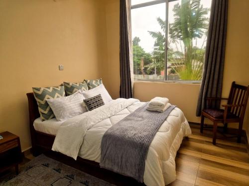 Кровать или кровати в номере cozy homes