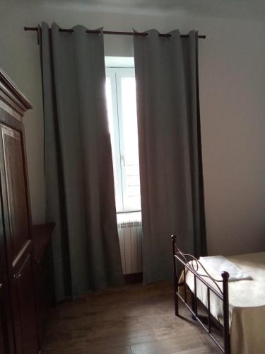 Postel nebo postele na pokoji v ubytování LOCANDA DEI FOLLI