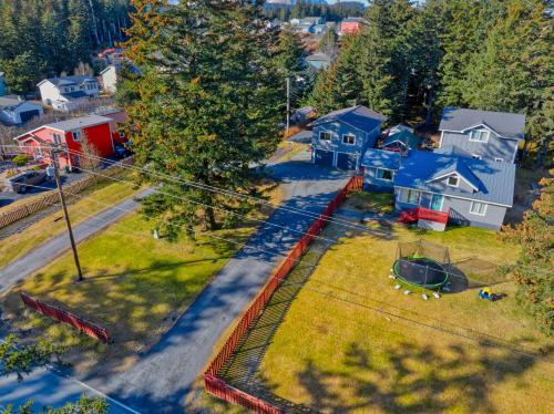 an aerial view of a neighborhood with houses and a yard at Captivating Coastline 2 BR Retreat with Ocean View in Kodiak