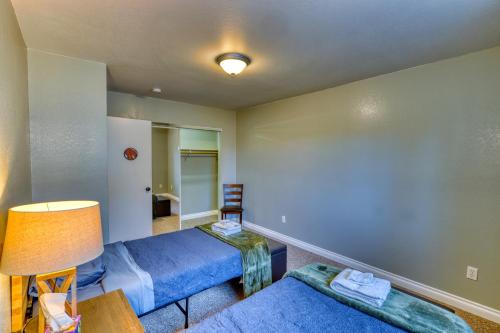 a living room with two beds and a couch at Rustic Retreat Charming 2 Bedroom Apt Sleeps 4 in Kodiak