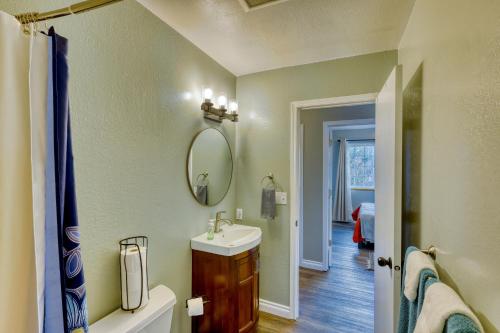 a bathroom with a sink and a mirror at Serene Retreat Charming 2 Bedroom Apt Sleeps 4 in Kodiak