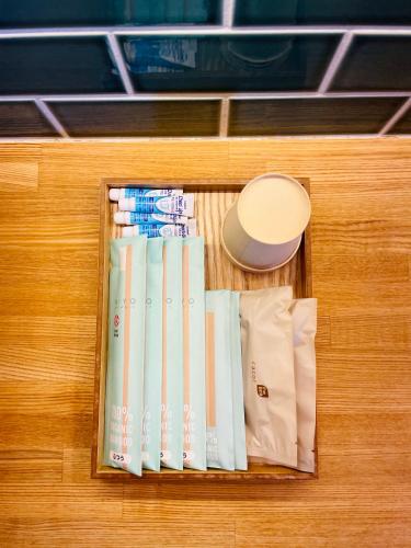 a drawer filled with books on top of a cabinet at PACIFICO SURF HOUSE - Mountain in Shishikui
