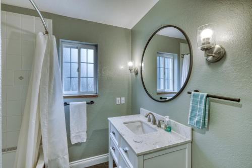 a bathroom with a sink and a mirror at Lodge Style Living Spacious 5BR Reunion Getaway in Kodiak