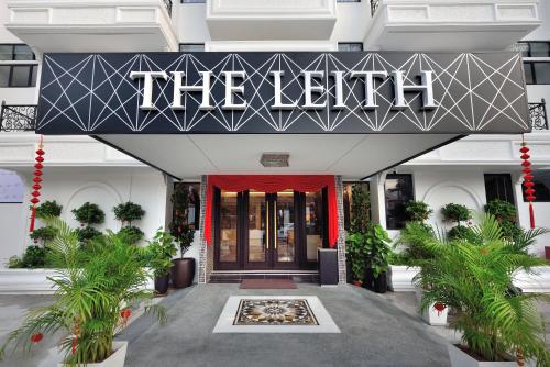 a hotel entrance with a sign that reads the exit at The Leith in George Town