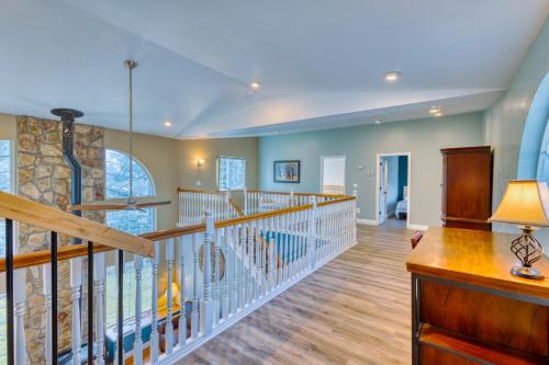 a large room with a staircase and a large window at Rustic Elegance 7 Bedrms 4 bath Cathedral Ceilings in Kodiak