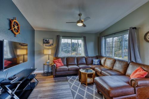 a living room with a couch and a tv at Rustic Elegance 7 Bedrms 4 bath Cathedral Ceilings in Kodiak