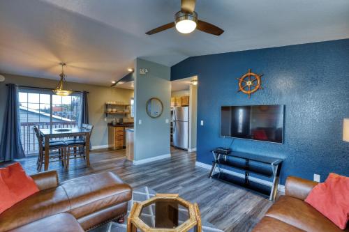 a living room with a couch and a dining room at Rustic Elegance 7 Bedrms 4 bath Cathedral Ceilings in Kodiak