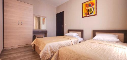 Postel nebo postele na pokoji v ubytování Sorento Sole Mare Apartments