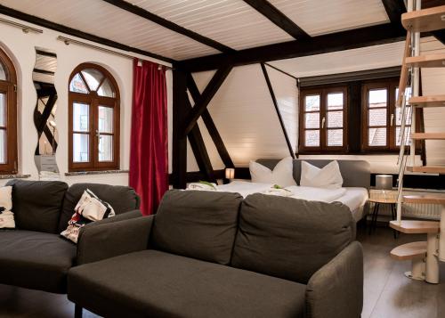 a living room with a couch and a bed at Trobischhof in Dresden
