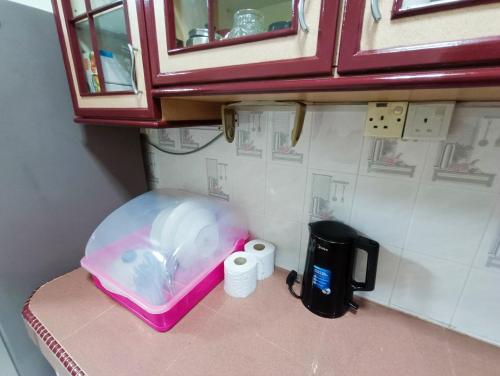 a plastic container on top of a counter with toilet paper at Kota 3BR Townhouse 5 Pax - TVBox/Mahjong/Jonker in Melaka