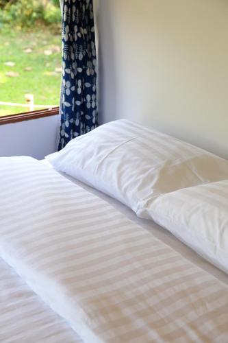 Postel nebo postele na pokoji v ubytování Hang Tueng farm stay Chiang Mai แฮงตึง ฟาร์มสเตย์ เชียงใหม่