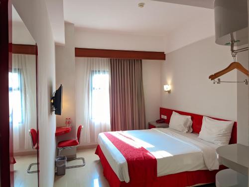Кровать или кровати в номере Brothers Inn Solo Baru