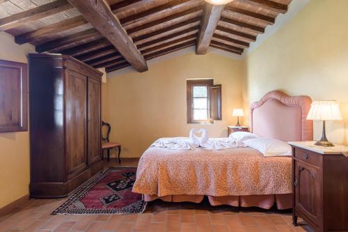 Ένα ή περισσότερα κρεβάτια σε δωμάτιο στο I Grandi Di Toscana