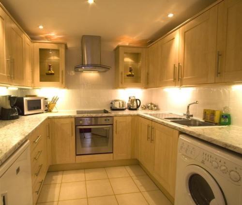 Kuchyň nebo kuchyňský kout v ubytování Apartments Royal