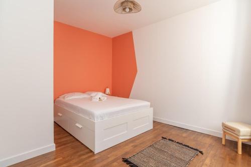 Ένα ή περισσότερα κρεβάτια σε δωμάτιο στο Magnifique logement spacieux hyper centre