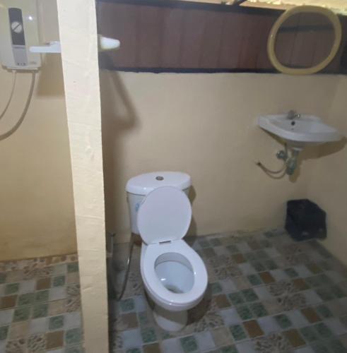 a bathroom with a toilet and a sink at Khlongsaeng farmstay in Ban Ta Khun
