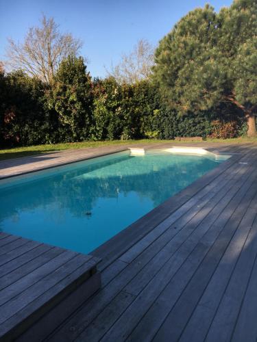 The swimming pool at or close to Villa K Maison archi avec piscine 15 mn PUY du FOU