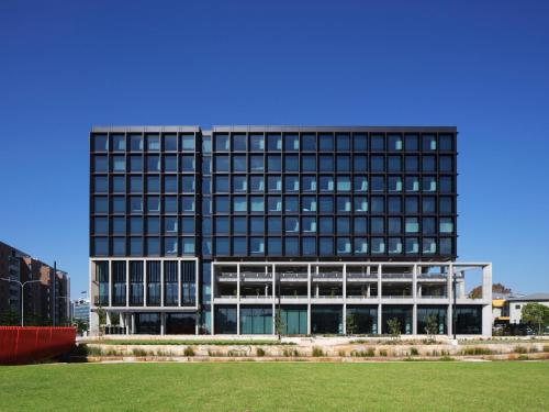 a large office building with a lot of windows at Little National Hotel Newcastle in Newcastle
