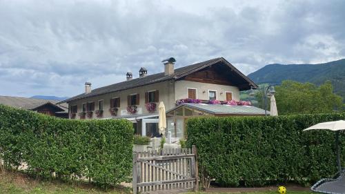 a house with a fence in front of it at Sturmhof in Chiusa