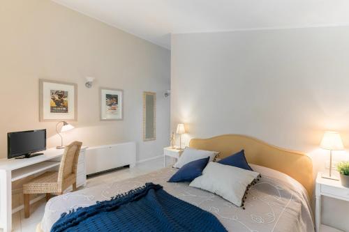 TV a/nebo společenská místnost v ubytování Adriano Residence
