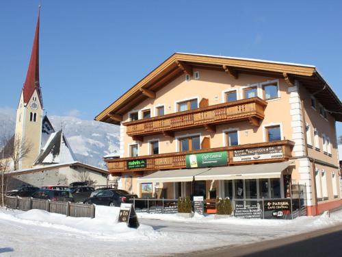 a large building with a church in the background at Spacious Apartment in Uderns near Ski Area in Uderns