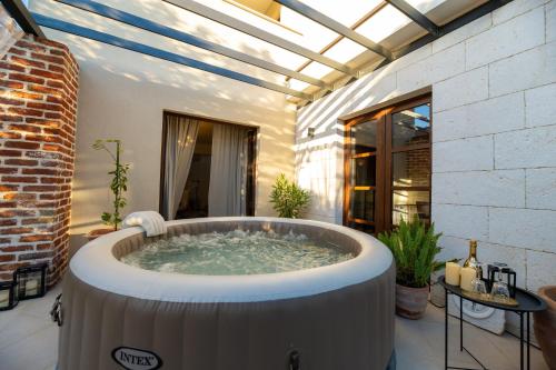 a hot tub in the middle of a patio at House "Mediterrian spirit" with jacuzzi in Zadar in Zadar
