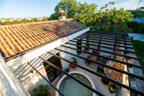 arial view of a house with stairs and a roof at House "Mediterrian spirit" with jacuzzi in Zadar in Zadar