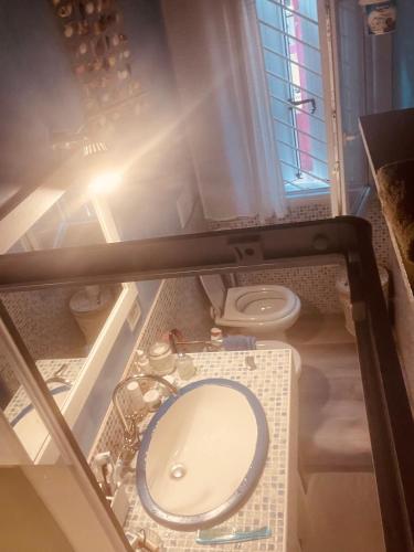 a bathroom with a toilet and a sink at La dolce dimora in Chioggia