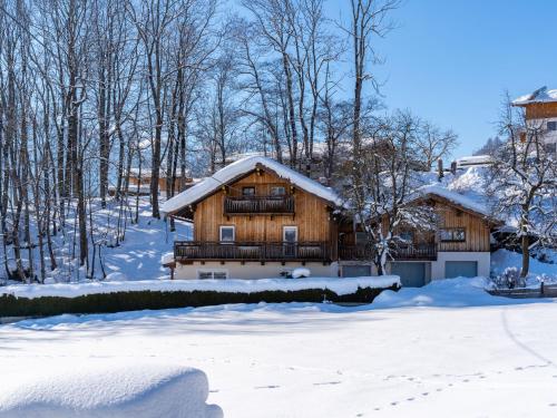 a log cabin in the snow at Special Apartment in Walchen with Private Terrace in Piesendorf