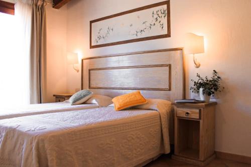 Postel nebo postele na pokoji v ubytování Hotel La Borgata