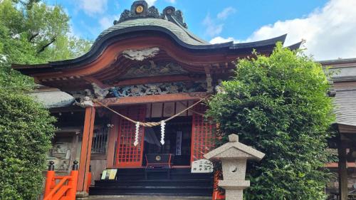 a shrine with an orange gate in front of it at Toyoko Inn Satsuma Sendai eki Higashi guchi in Satsumasendai