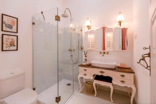 a bathroom with a sink and a shower at Torres da Vila in Anadia