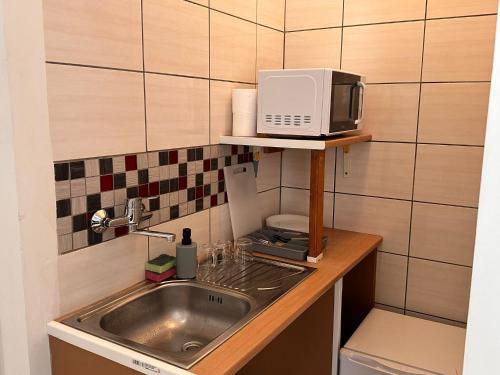 Køkken eller tekøkken på Apartamenty Gołębia-Budget