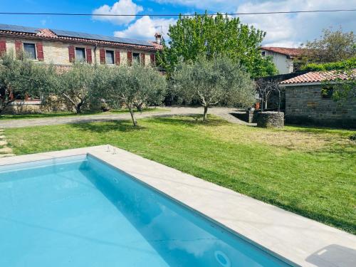 a swimming pool in the yard of a house at Paradise villa with private swimming pool in Koper