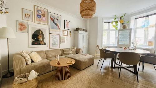 a living room with a couch and a table at ApartmentInCopenhagen Apartment 1614 in Copenhagen