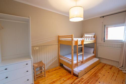 Ένα ή περισσότερα κρεβάτια σε δωμάτιο στο Apartament la Llúdriga