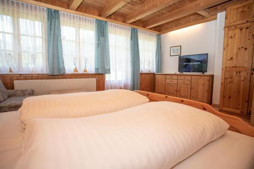 Postel nebo postele na pokoji v ubytování Schaffergut Appartements