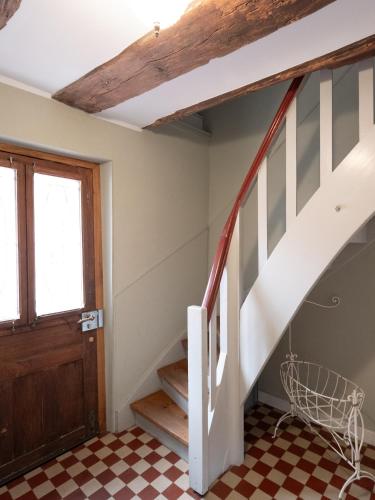 a staircase in a house with a checkered floor at REFUGIUM Theresienstraße 19 - Chambre Monet in Rhodt unter Rietburg