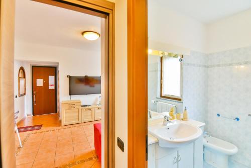 a bathroom with a sink and a tub at Jane e Jolie holiday home private swimming pool in Valbrona