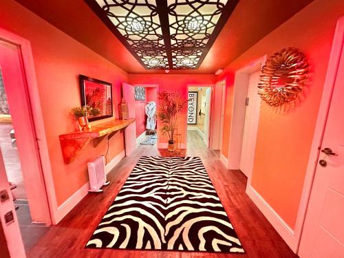 a hallway with a zebra rug on the floor at Beyond - Romantic Basement Apartment - Close To Beach - With Parking in Bournemouth