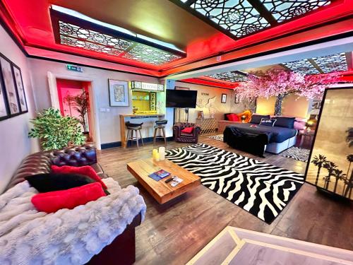 a large living room with a zebra patterned rug at Beyond - Romantic Basement Apartment - Close To Beach - With Parking in Bournemouth