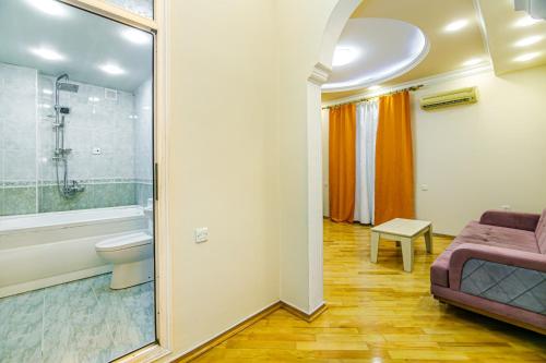 a bathroom with a sink toilet and a shower at Boulvard M Estate in Baku