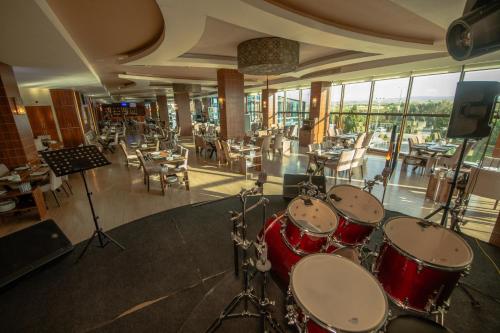 a room with a drum set in a restaurant at Grand Hotel & Convention Center Karaman in Karaman